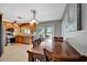 Dining area with a view of the kitchen, plenty of sunshine, and access to the patio at 7055 Kenwood Dr, North Port, FL 34287