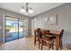 Dining area with access to the screened patio and an elegant decorative wall art at 7055 Kenwood Dr, North Port, FL 34287