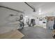 Organized garage with a bike and gym floor providing practical storage solutions and functionality at 7055 Kenwood Dr, North Port, FL 34287