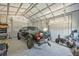 Spacious garage featuring a truck, motorcycle, and ample storage space, perfect for hobbyists and vehicle enthusiasts at 7055 Kenwood Dr, North Port, FL 34287