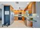 Well-lit kitchen featuring stainless steel appliances and adjacent dog bowls at 7055 Kenwood Dr, North Port, FL 34287