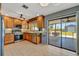 Updated kitchen with stainless appliances and views of the lanai and backyard at 7055 Kenwood Dr, North Port, FL 34287