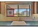Close up of kitchen sink, window, tile backsplash and view of outside shed at 7055 Kenwood Dr, North Port, FL 34287