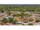 Overview of a quiet neighborhood street with mature landscaping and well-maintained homes at 7055 Kenwood Dr, North Port, FL 34287