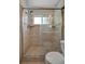 Modern bathroom shower with tile walls, glass door, and updated fixtures for a luxurious feel at 7055 Kenwood Dr, North Port, FL 34287