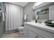 Well-lit bathroom with a white vanity, a shower-tub combination, and a fresh, clean design at 709 84Th Nw St, Bradenton, FL 34209