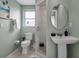Bright bathroom featuring modern fixtures, shower, and elegant vanity at 709 84Th Nw St, Bradenton, FL 34209