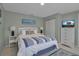 Comfortable bedroom featuring nautical decor, complemented by a TV and ample storage at 709 84Th Nw St, Bradenton, FL 34209