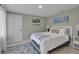 Inviting bedroom with a comfortable bed, coastal artwork, a stylish rug, and a peaceful, relaxing vibe at 709 84Th Nw St, Bradenton, FL 34209