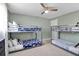 Bedroom featuring bunk beds, ceiling fan, ample space for sleep and play at 709 84Th Nw St, Bradenton, FL 34209