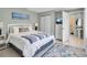 Bedroom with nautical decor, ensuite bathroom and plenty of natural light at 709 84Th Nw St, Bradenton, FL 34209