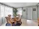 Cozy dining space with wicker chairs, a glass-top table, beachy decor, and a charming, relaxed atmosphere at 709 84Th Nw St, Bradenton, FL 34209