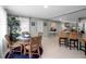 Dining area features a woven dining set, natural lighting, and access to the open concept kitchen at 709 84Th Nw St, Bradenton, FL 34209