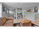 Comfortable living room featuring a cozy seating area, stylish rug, and beach-themed decor at 709 84Th Nw St, Bradenton, FL 34209