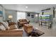 Comfortable living room featuring a cozy seating area, stylish rug, and beach-themed decor at 709 84Th Nw St, Bradenton, FL 34209