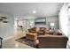 Bright living room with neutral walls, comfortable leather seating, and an adjacent dining area at 709 84Th Nw St, Bradenton, FL 34209