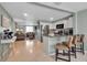 Open concept living space with a view of the kitchen and features bar seating and stainless steel appliances at 709 84Th Nw St, Bradenton, FL 34209