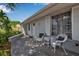 Inviting front porch with seating, white shutters, and well-maintained landscaping at 709 84Th Nw St, Bradenton, FL 34209