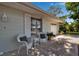 Inviting front porch with seating, white shutters, and well-maintained landscaping at 709 84Th Nw St, Bradenton, FL 34209