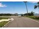 Street view leading to the community boat dock with boat lift and water access at 709 84Th Nw St, Bradenton, FL 34209