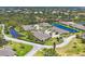 Aerial view of properties with lush landscaping surrounding waterfront homes at 7374 Royal Birkdale Dr # 15D, Sarasota, FL 34238