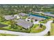 Aerial view of waterfront homes with beautifully landscaped lawns and mature trees at 7374 Royal Birkdale Dr # 15D, Sarasota, FL 34238