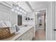 Bright bathroom with tile floors, lots of lighting, and vanity at 7374 Royal Birkdale Dr # 15D, Sarasota, FL 34238