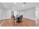 Dining area with wood floors, contemporary table, and recessed lighting at 7374 Royal Birkdale Dr # 15D, Sarasota, FL 34238