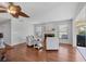 Cozy living room with wood floors, a decorative fireplace, and comfortable seating at 7374 Royal Birkdale Dr # 15D, Sarasota, FL 34238