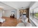 Open living room with hardwood floors and big windows providing natural light throughout the house at 7374 Royal Birkdale Dr # 15D, Sarasota, FL 34238