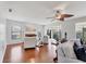 Bright living room with hardwood floors, fireplace, and lots of natural light at 7374 Royal Birkdale Dr # 15D, Sarasota, FL 34238
