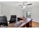 Home office with a large desk, comfortable chair, and bright window at 7374 Royal Birkdale Dr # 15D, Sarasota, FL 34238