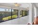 Sunroom with glass doors and lots of natural light at 7374 Royal Birkdale Dr # 15D, Sarasota, FL 34238