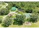 Aerial view showcasing community amenities including tennis and basketball courts plus playground at 8121 Snowy Egret Pl, Bradenton, FL 34202