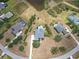 A high-angle aerial view shows a home with a backyard pool and surrounding landscaping at 8121 Snowy Egret Pl, Bradenton, FL 34202