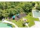 Aerial view showcasing community amenities including tennis and basketball courts plus playground at 8121 Snowy Egret Pl, Bradenton, FL 34202