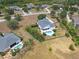 Aerial view of the home with a backyard pool, privacy fence, and landscaping at 8121 Snowy Egret Pl, Bradenton, FL 34202