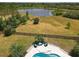 Backyard view showing an outdoor seating area and pool at 8121 Snowy Egret Pl, Bradenton, FL 34202