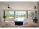 Stunning backyard view featuring a luxurious pool area, open views, and meticulous landscaping at 8121 Snowy Egret Pl, Bradenton, FL 34202