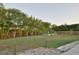 Landscaped backyard with tropical plants, garden beds, landscape lighting and decorative rocks at 8121 Snowy Egret Pl, Bradenton, FL 34202