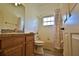 Neutral toned bathroom with shower/tub, oak vanity, and natural light creating a refreshing space at 8121 Snowy Egret Pl, Bradenton, FL 34202