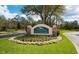 Community sign for Preserve at Panther Ridge with beautiful landscaping and stone pillar accents at 8121 Snowy Egret Pl, Bradenton, FL 34202
