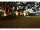 Beautiful home with manicured landscaping and illuminated features, highlighting its architectural details at 8121 Snowy Egret Pl, Bradenton, FL 34202