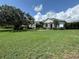 Charming single-story home featuring a spacious front yard, beautiful landscaping, and inviting curb appeal at 8121 Snowy Egret Pl, Bradenton, FL 34202