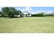 Attractive home with a well-kept lawn and mature trees, offering a peaceful and welcoming atmosphere at 8121 Snowy Egret Pl, Bradenton, FL 34202