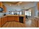 Kitchen has modern appliances, wood cabinets and large center island at 8121 Snowy Egret Pl, Bradenton, FL 34202