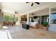 Bright living room featuring neutral decor, tile flooring, and sliding glass doors to the outside area at 8121 Snowy Egret Pl, Bradenton, FL 34202