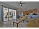 Living room view to covered patio, kitchen and dining area at 8121 Snowy Egret Pl, Bradenton, FL 34202