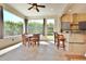 Bright living room featuring neutral decor, dining and bar areas, and a clear view to the outside at 8121 Snowy Egret Pl, Bradenton, FL 34202
