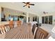 Bright living room featuring neutral decor, tile flooring, and sliding glass doors to the backyard at 8121 Snowy Egret Pl, Bradenton, FL 34202